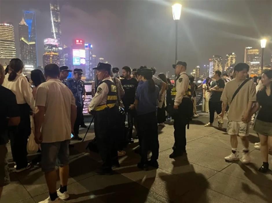 unlicensed photographers hogging prime spots on shanghai's iconic bund