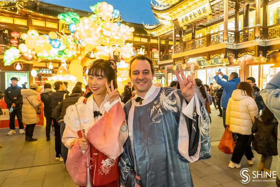 in <i>hanfu</i> costume, soaking up culture in the city's traditional lantern fair