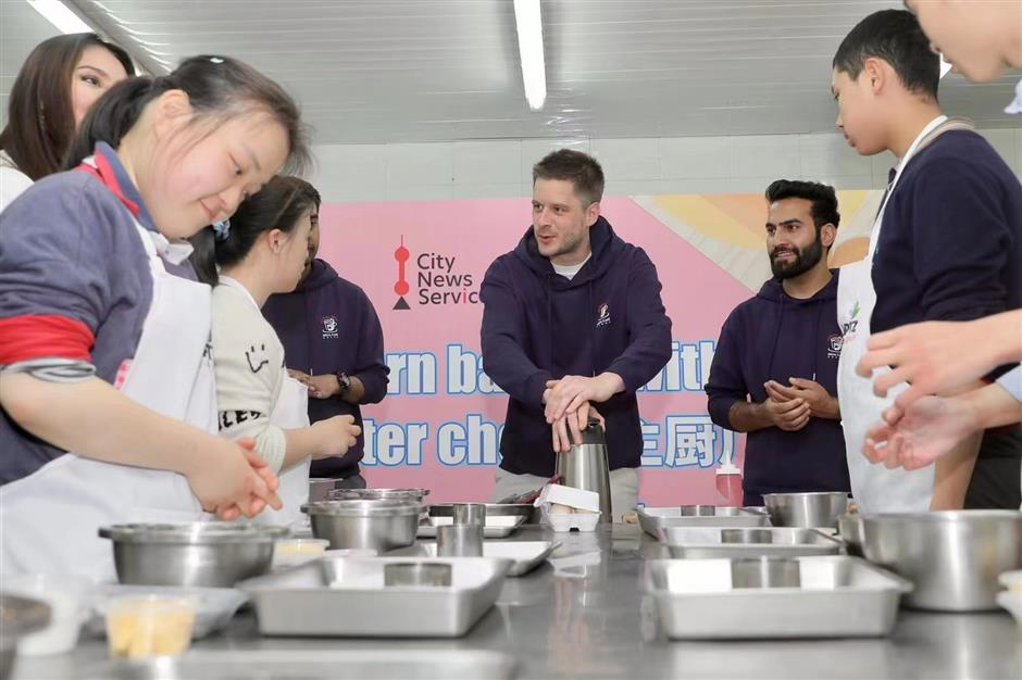 global volunteers come together to bake and learn with special needs students in shanghai