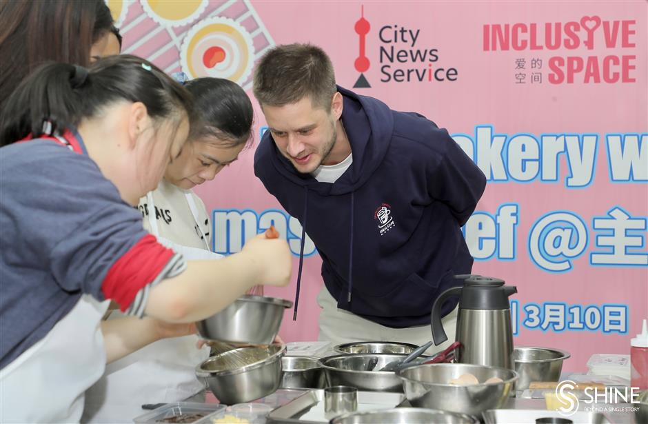 global volunteers come together to bake and learn with special needs students in shanghai