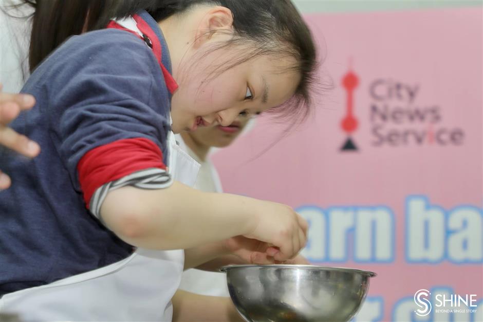 global volunteers come together to bake and learn with special needs students in shanghai