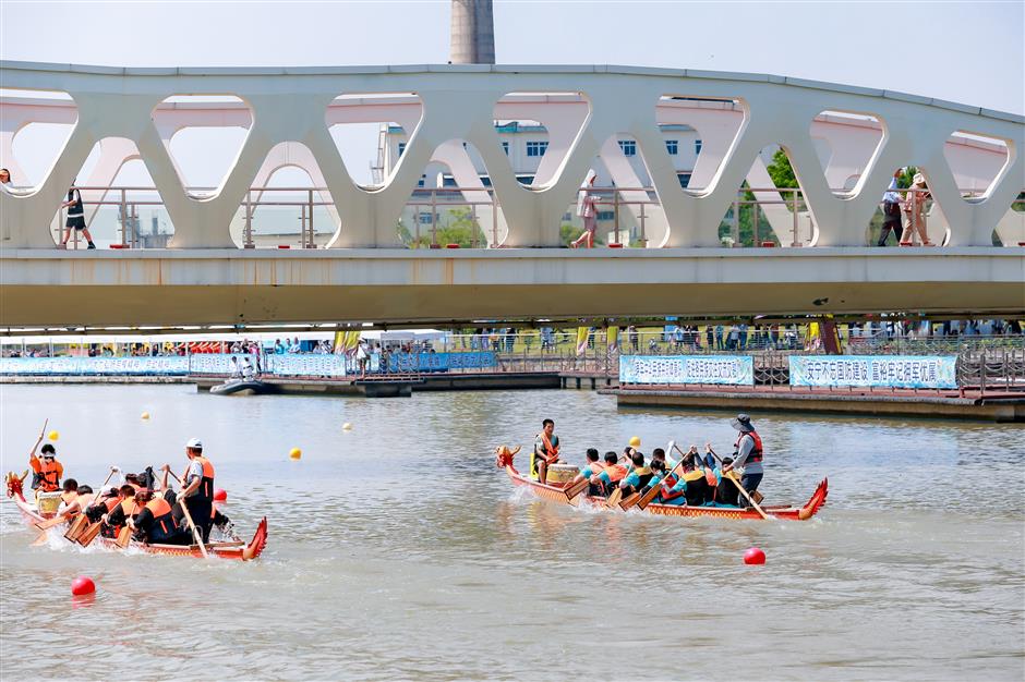 dragon boat teams compete on suburban river