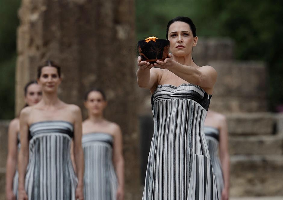 olympic flame for paris 2024 summer games lit in ancient olympia