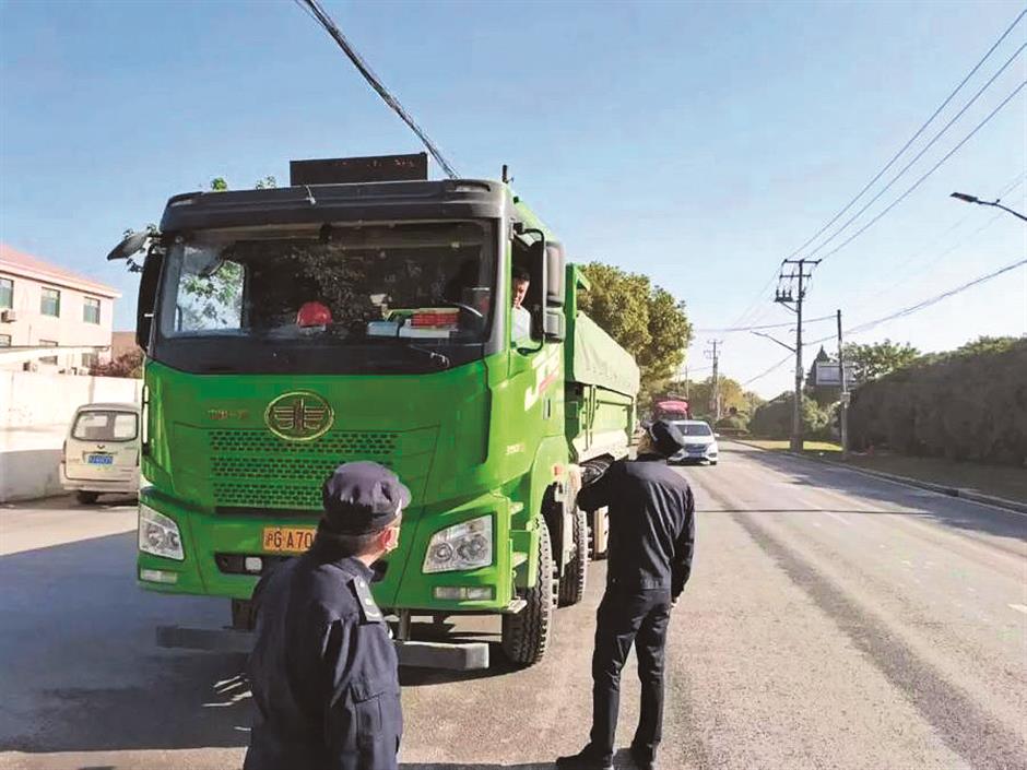 huacao town targets trash from rapid development