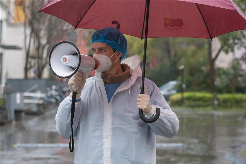 do your test! hurry up! british volunteer wields the megaphone