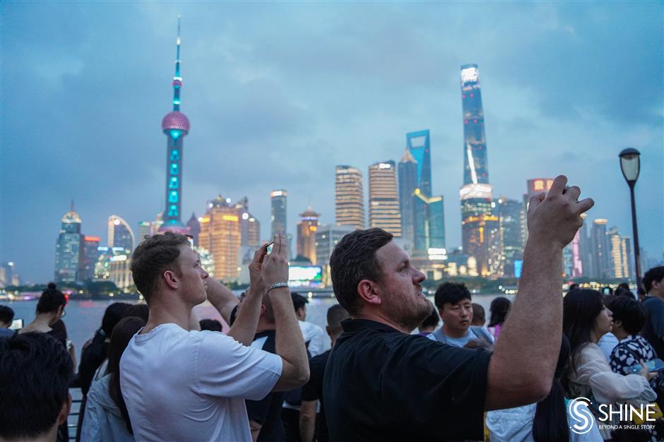 beautiful bund! shanghai dazzles as the night lights come on