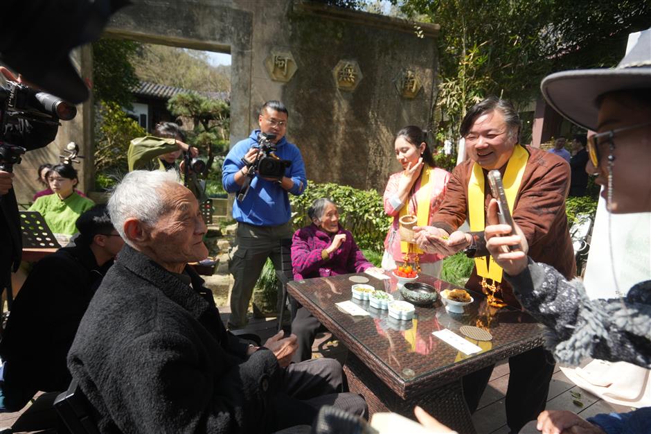 monk biancai honored as first of year's longjing tea brewed