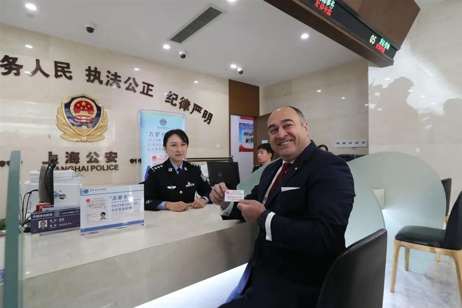 shanghai expats receive new 'five-star' permanent residence id cards