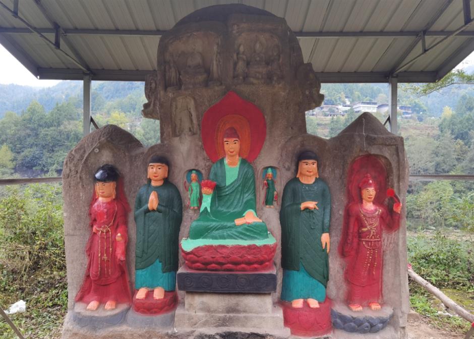 public sees red as buddhist cliff carvings painted in bright colors