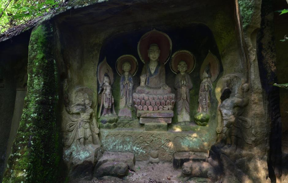 public sees red as buddhist cliff carvings painted in bright colors